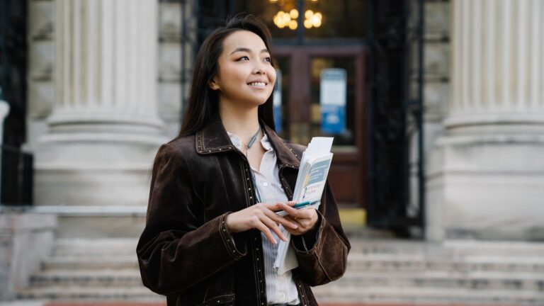 CF-Student Holding Book